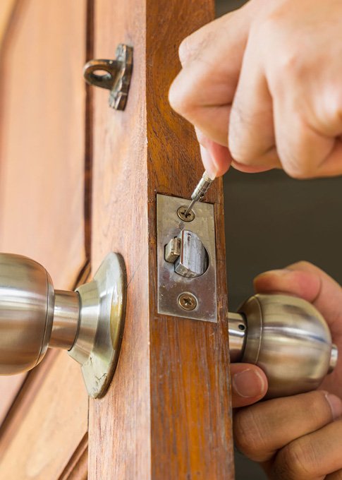 Professional locksmith rekeying locks