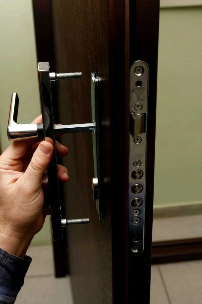 Professional locksmith technician working on lock installation