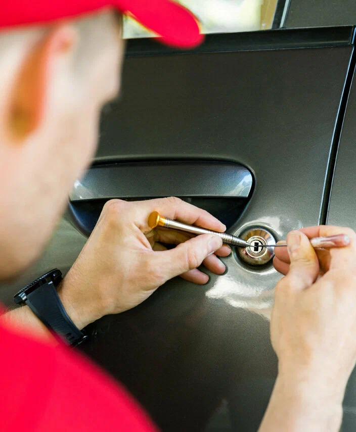 Professional locksmith assisting with car lockout