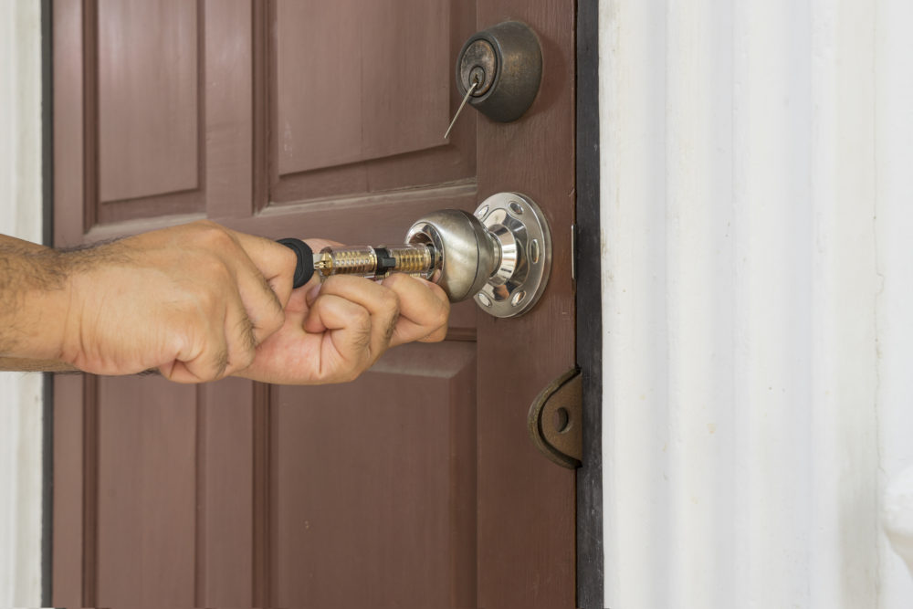 Professional locksmith rekeying locks